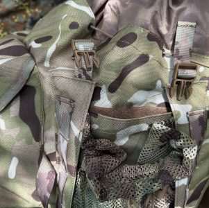 The mesh side pouches feature a separate flat compartment - secured by velcro, designed for stashing bivi poles or other items