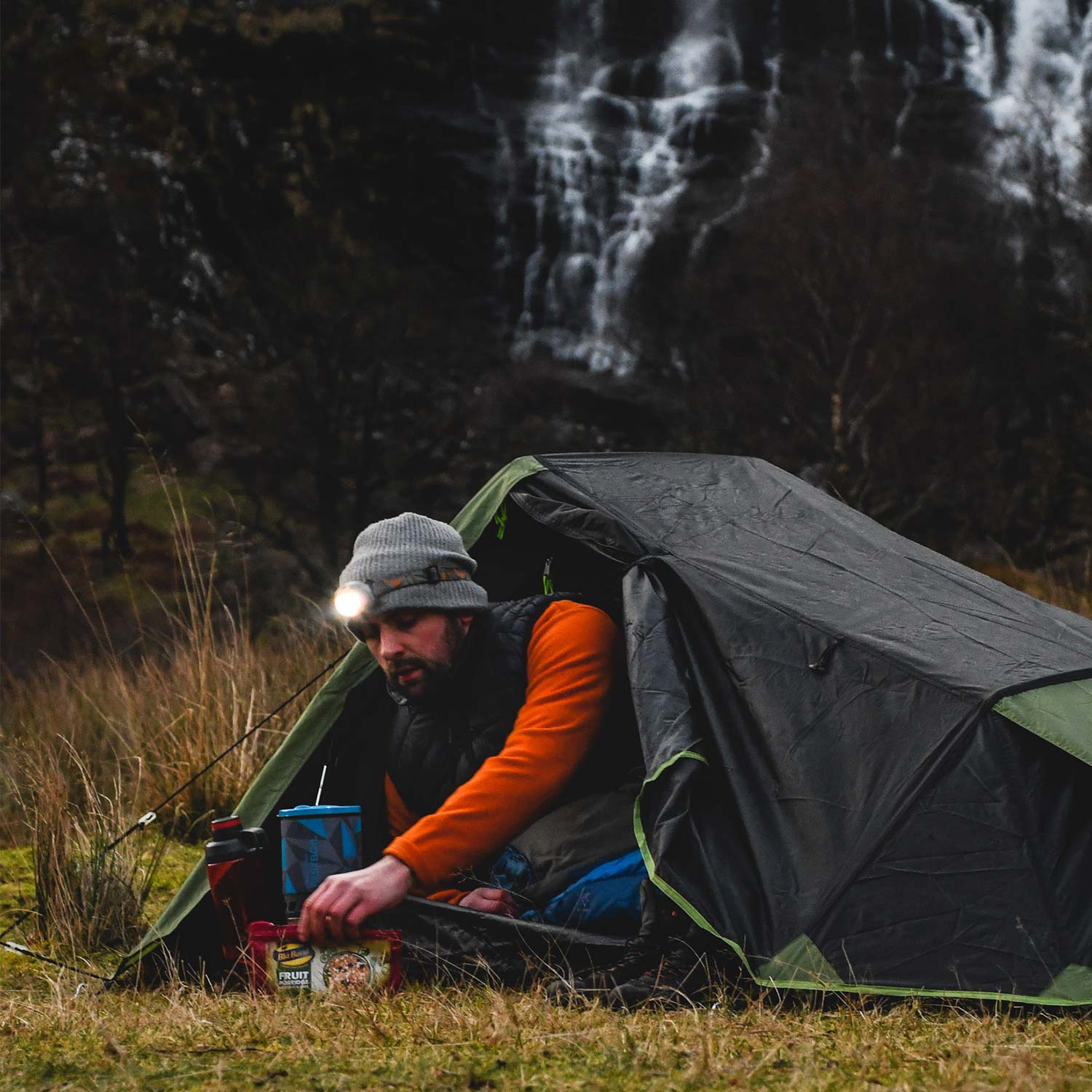 Camper using the Fastboil cooking system gas stove