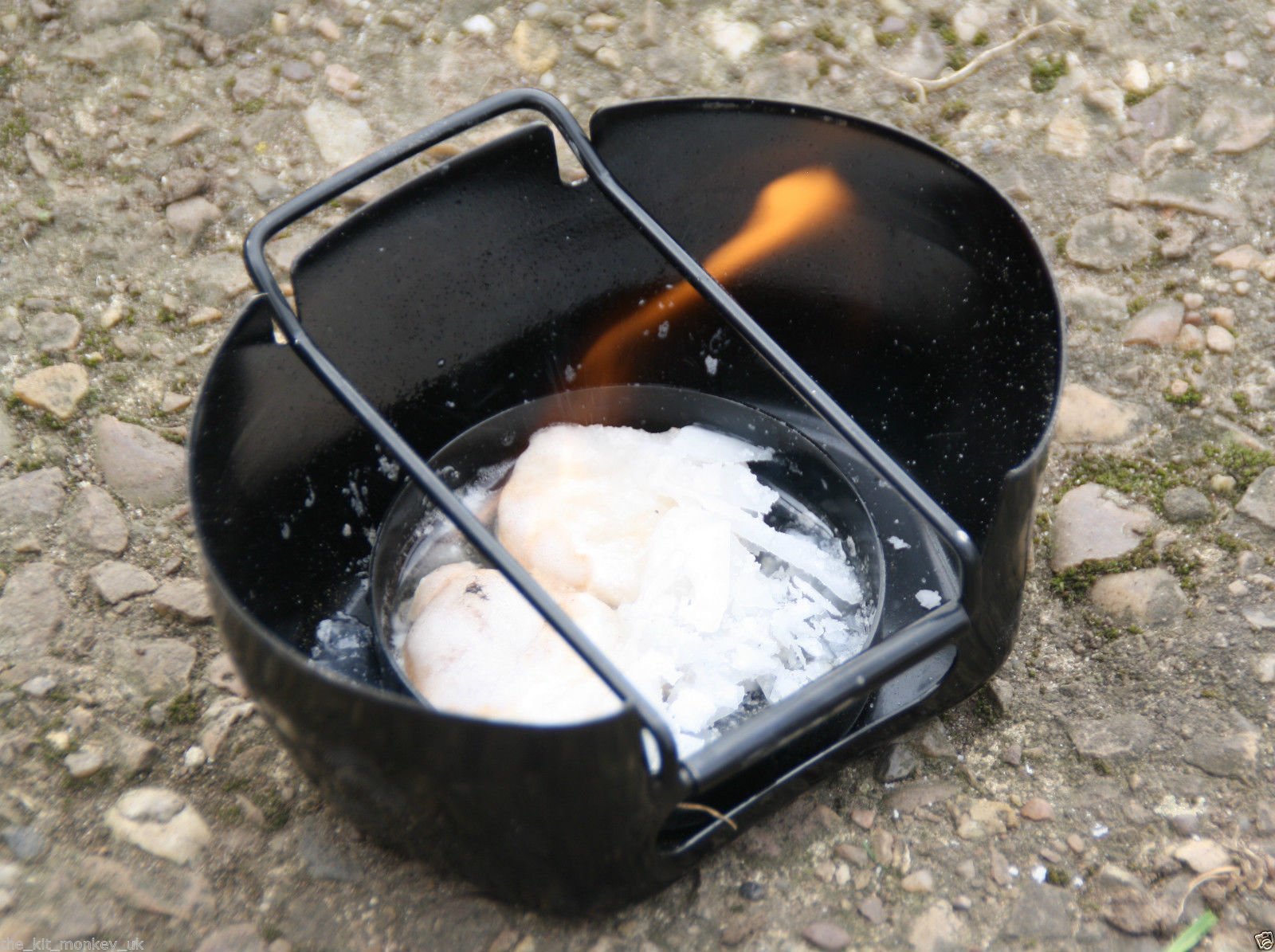 Crusader Cooking Set Black with flame, showcasing compact outdoor cooking system for boiling water and replacing traditional mess tins.